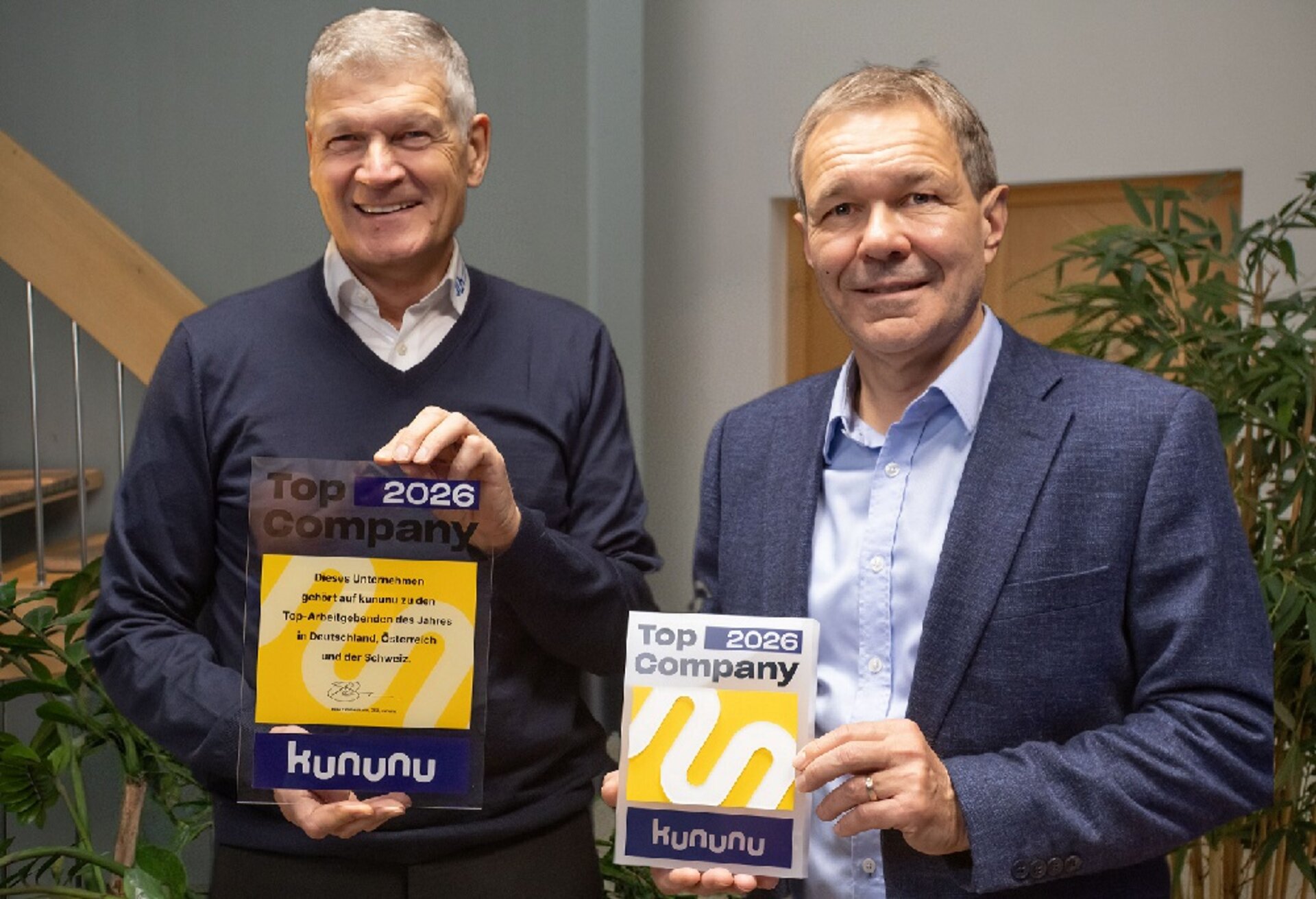 Jörg Strötzel und Uwe Rauhöft mit dem Kununu-Award